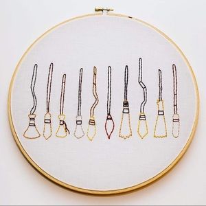 Hand-embroidered art. Harry Potter broomsticks!